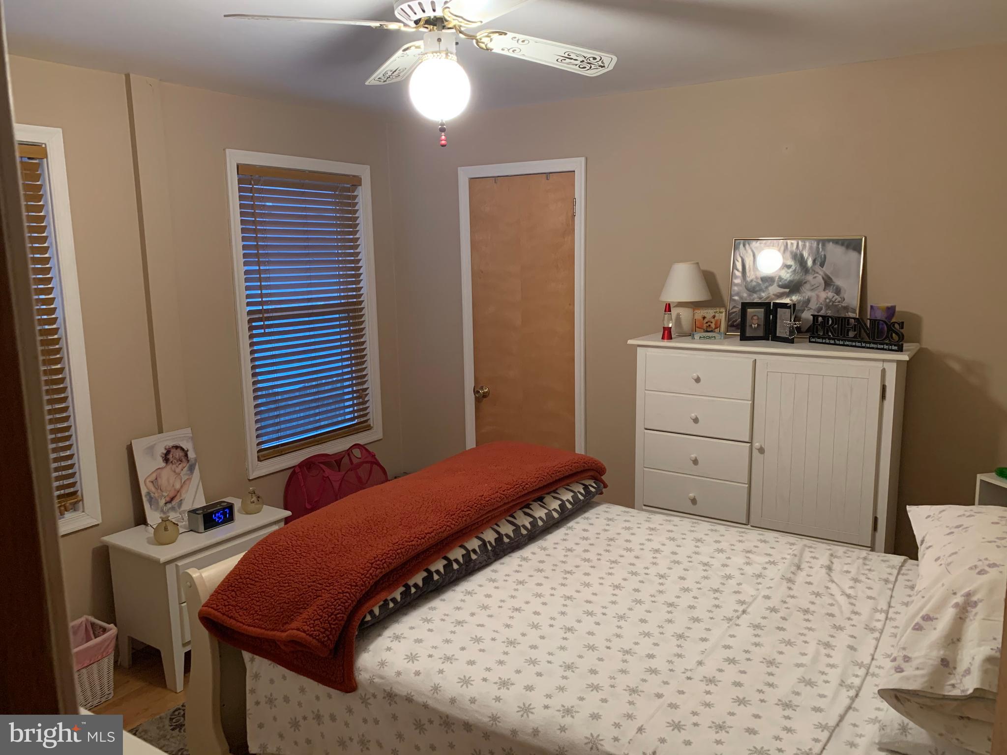 1052 Almonesson Road Westville, NJ 08093 - Photo 6 of 17 a bedroom with a bed and a chandelier