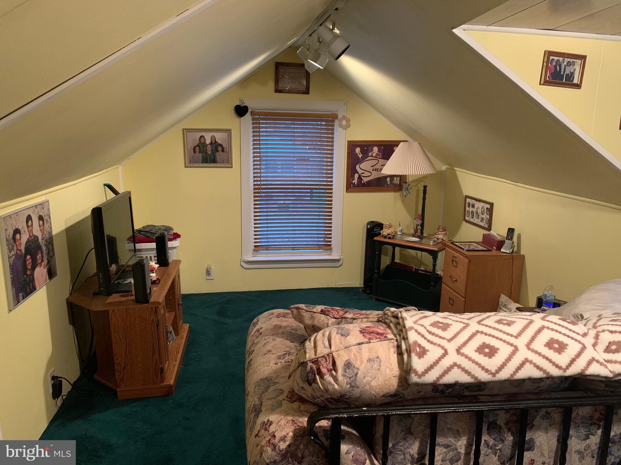 1052 Almonesson Road Westville, NJ 08093 - Photo 9 of 17 a bedroom with bed and wooden floor