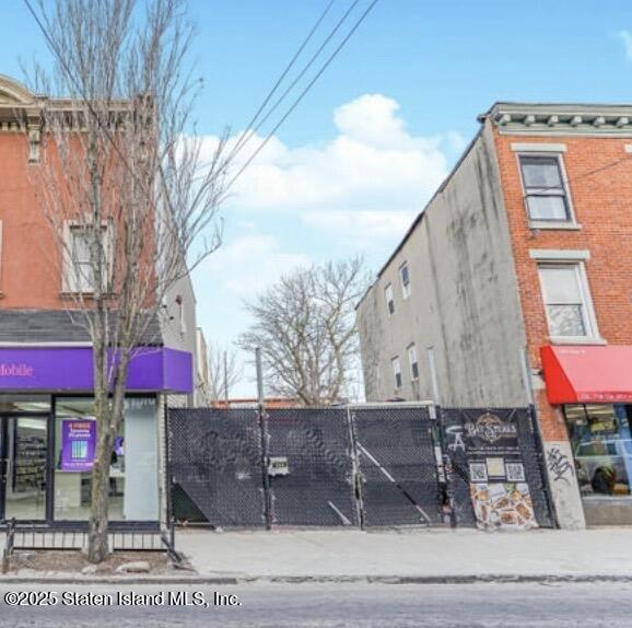 591 Bay Street Staten Island, NY 10304 - Photo 1 of 4 a street sign on a pole next to a road