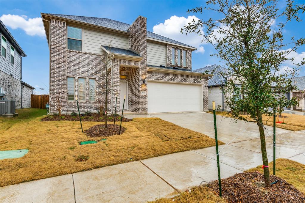 2544 Rambling Road Celina, TX 75009 - Photo 2 of 25 View of front facade featuring a garage, a front yard, and central air condition unit