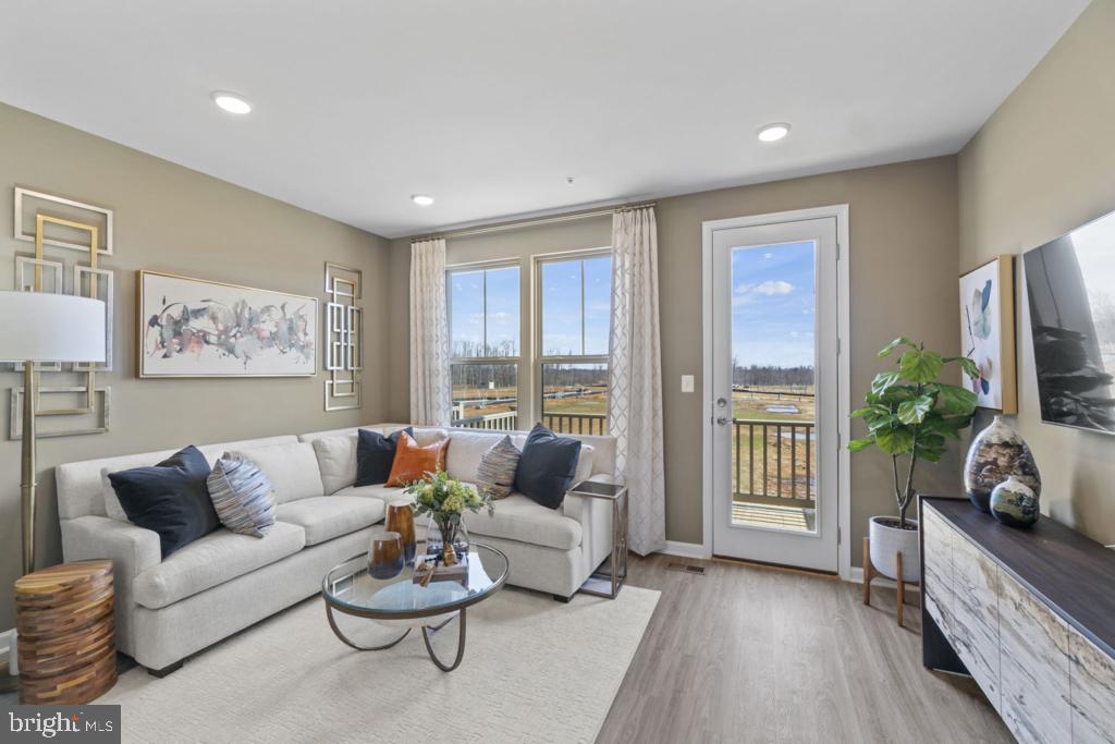 12535 Terrabrooke Avenue Brandywine, MD 20613 - Photo 17 of 32 a living room with furniture and a large window