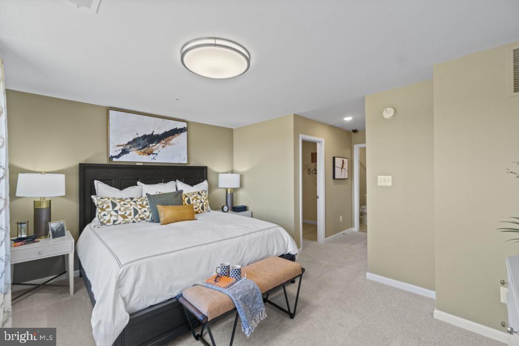 12535 Terrabrooke Avenue Brandywine, MD 20613 - Photo 24 of 32 a bedroom with bed and a painting on the wall