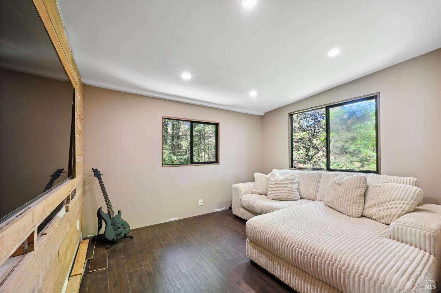 21713 Starrett Hill Drive Monte Rio, CA 95462 - Photo 18 of 50 a living room with furniture and a window