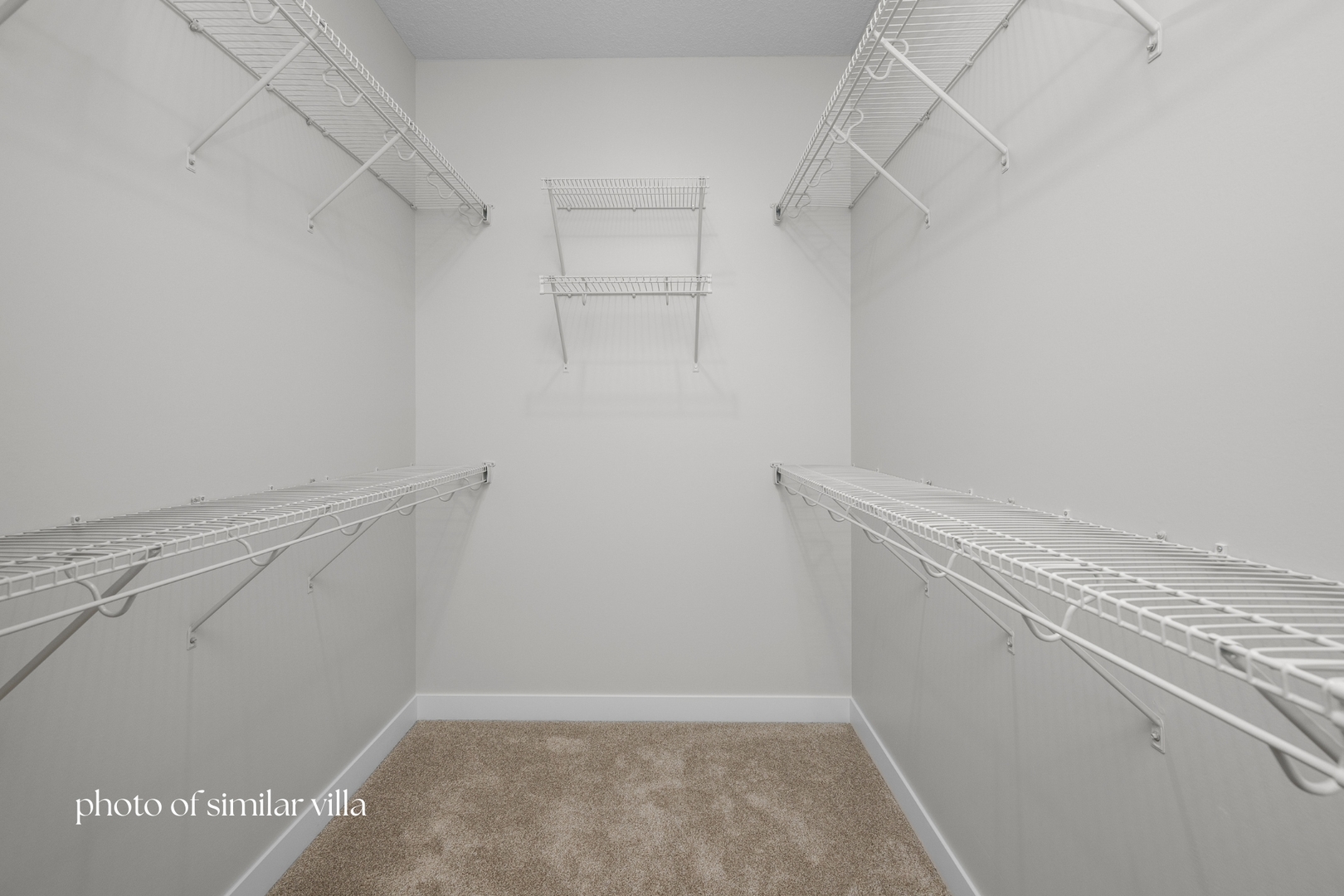 1867 Redbud Circle, Unit 101 Eldridge, IA 52748 - Photo 24 of 31 a view of a room with racks on the wall