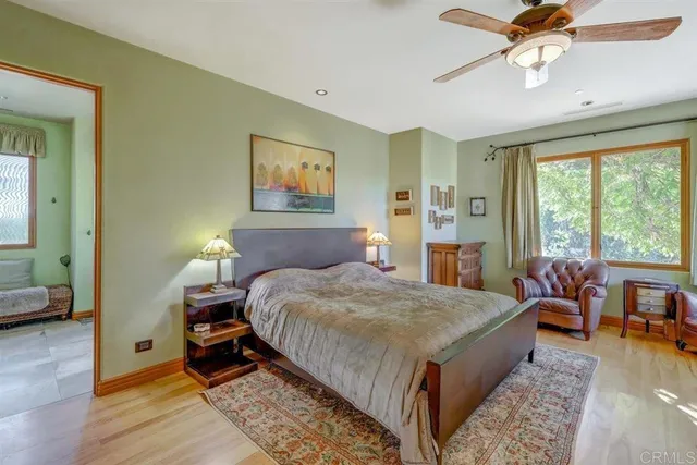 a view of a yard with plants and wooden fence