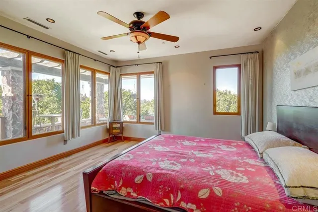 a view of a porch with furniture and a large window