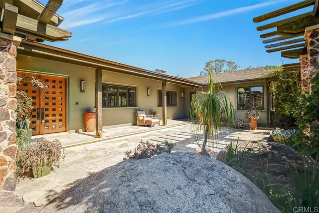 a large kitchen with stainless steel appliances granite countertop a large stove a sink and dishwasher