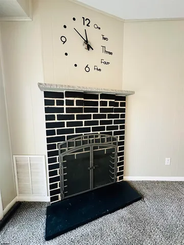 an empty room with windows and entrance