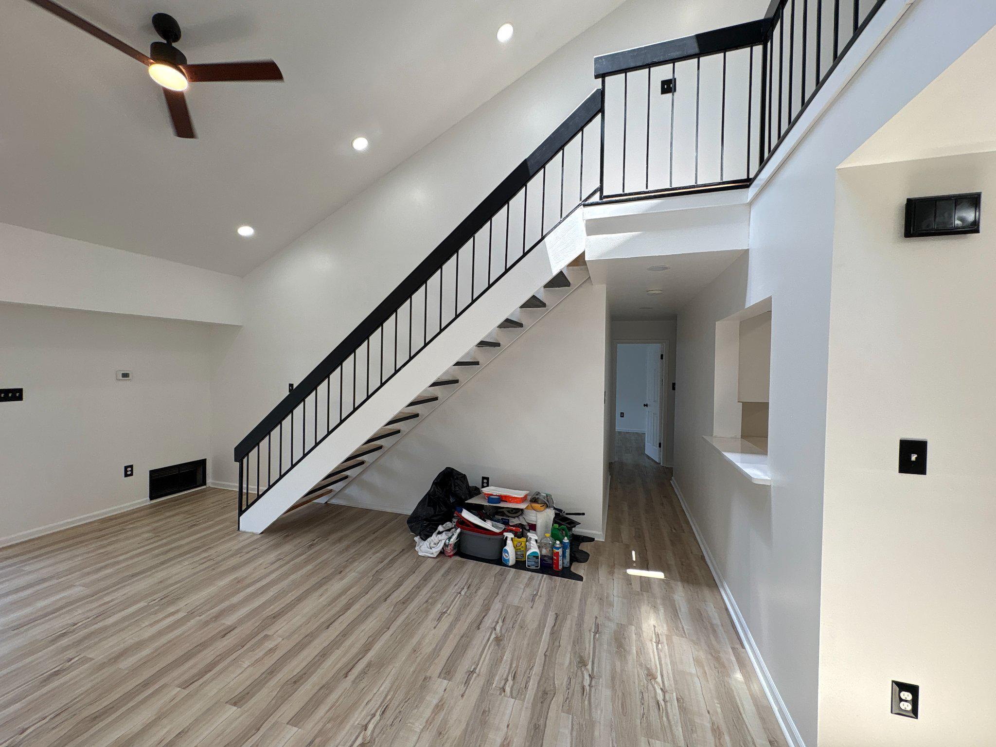 72304 Delaire Landing Road, Unit 304 Philadelphia, PA 19114 - Photo 15 of 56 Spacious modern living area with stairs.