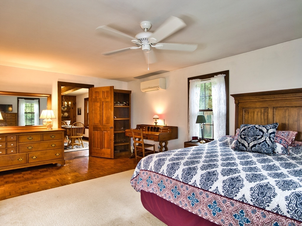 772 Gifford Road Westport, MA 02790 - Photo 18 of 37 a bedroom with a large bed and a window