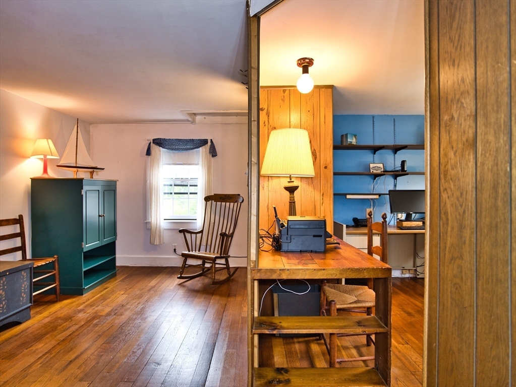 772 Gifford Road Westport, MA 02790 - Photo 20 of 37 a view of a workspace with furniture and wooden floor