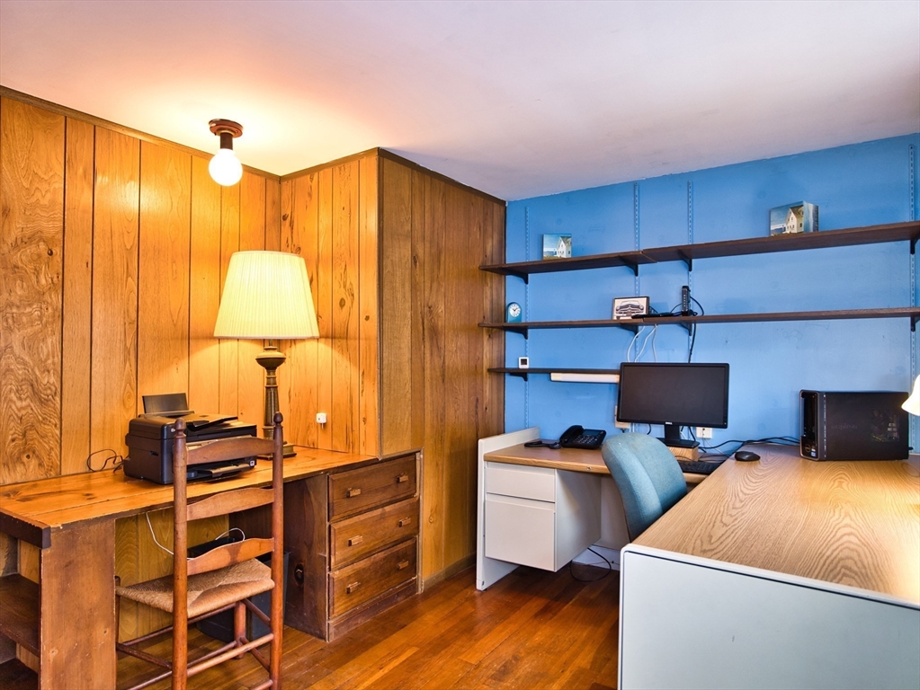 772 Gifford Road Westport, MA 02790 - Photo 22 of 37 a room with cabinets chairs and wooden floor
