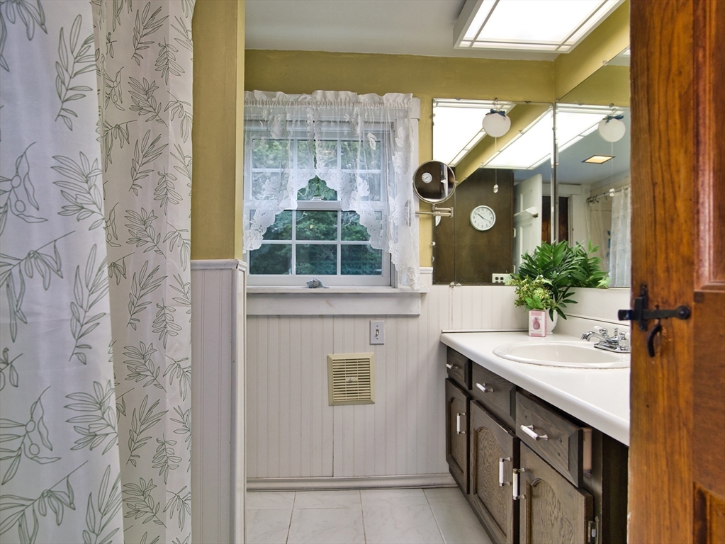 772 Gifford Road Westport, MA 02790 - Photo 23 of 37 a bathroom with a sink and a mirror