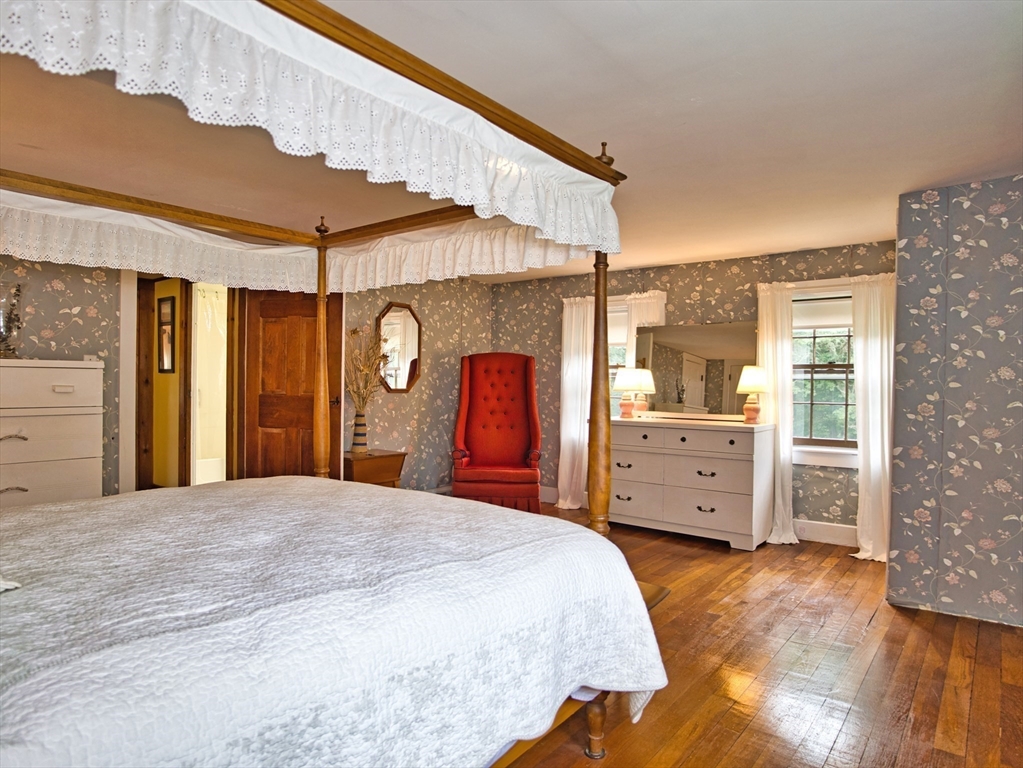 772 Gifford Road Westport, MA 02790 - Photo 26 of 37 a large bedroom with a bed and a dresser
