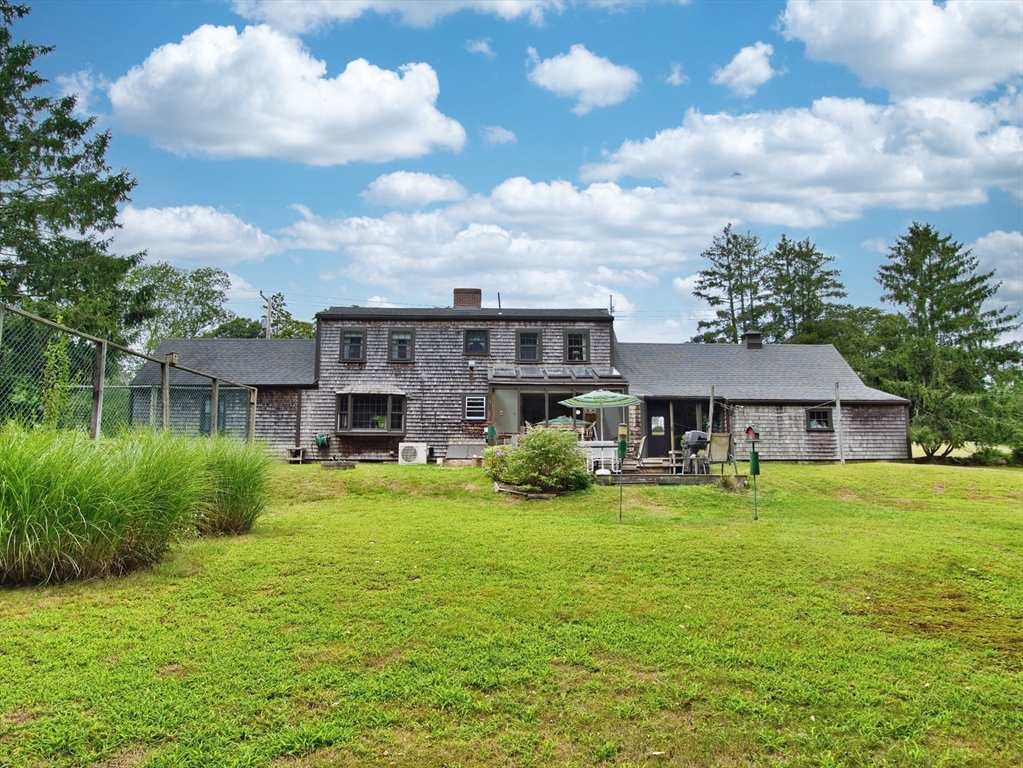 772 Gifford Road Westport, MA 02790 - Photo 30 of 37 a view of a house with a big yard potted plants and large tree