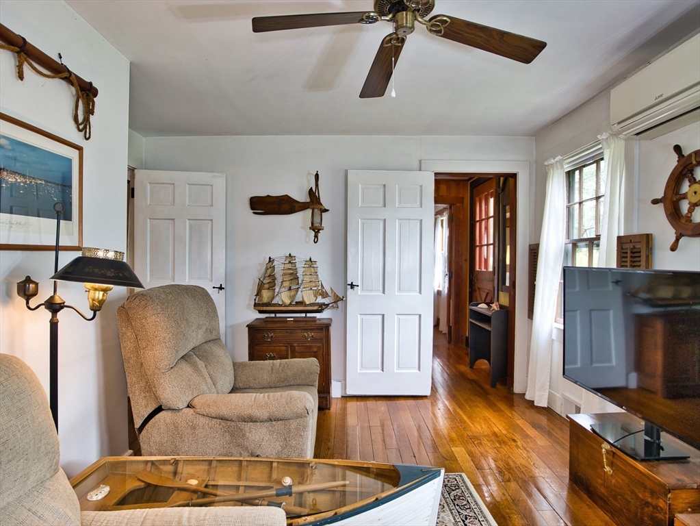 772 Gifford Road Westport, MA 02790 - Photo 10 of 37 a living room with furniture and a flat screen tv