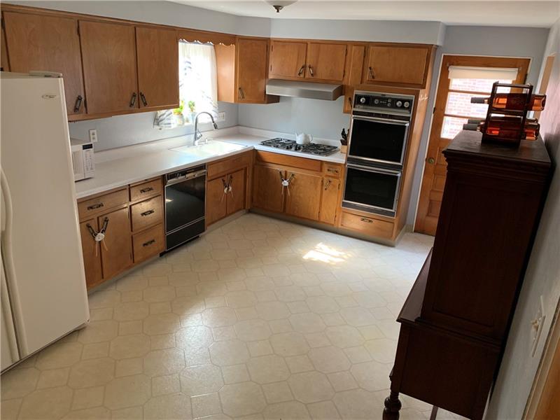 341 Orchard Spring Road Pittsburgh, PA 15220 - Photo 6 of 14 Large eat in Kitchen Walk out to side porch