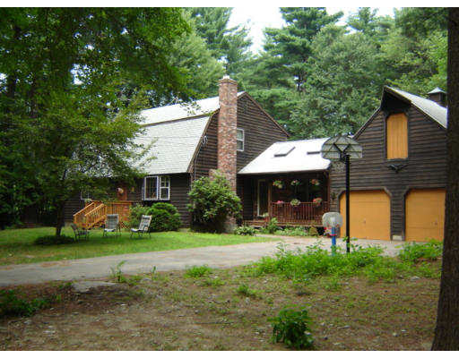 135 Manchaug Road Douglas, MA 01516 - Photo 1 of 1 a front view of a house with garden