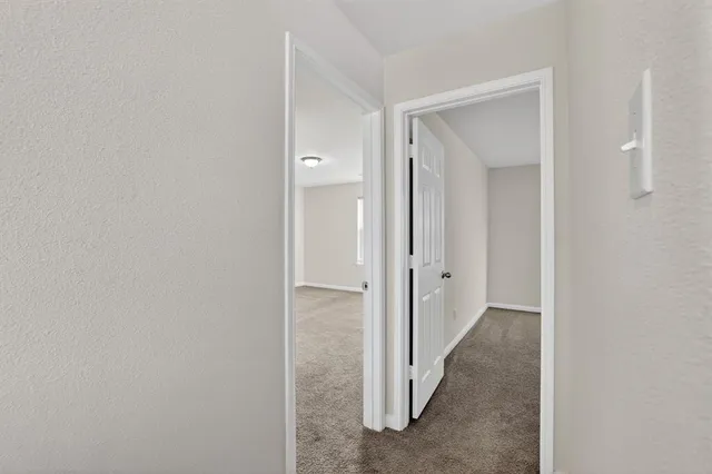 a view of a room with a hallway