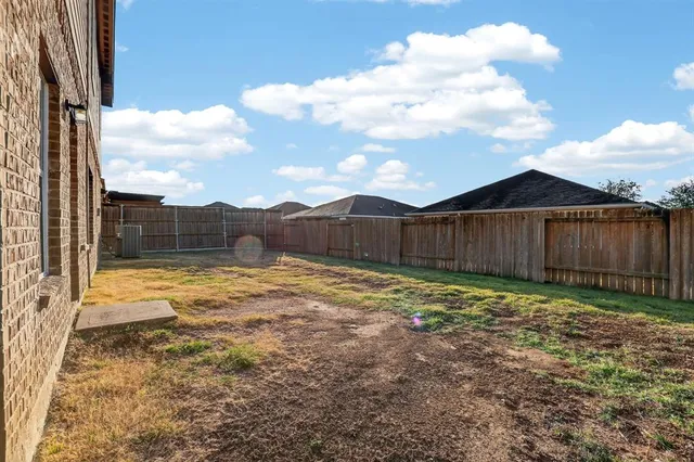 a view of a backyard with tub