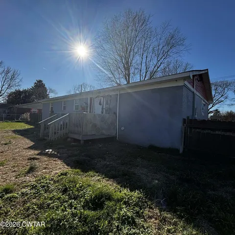 a view of backyard and pathway