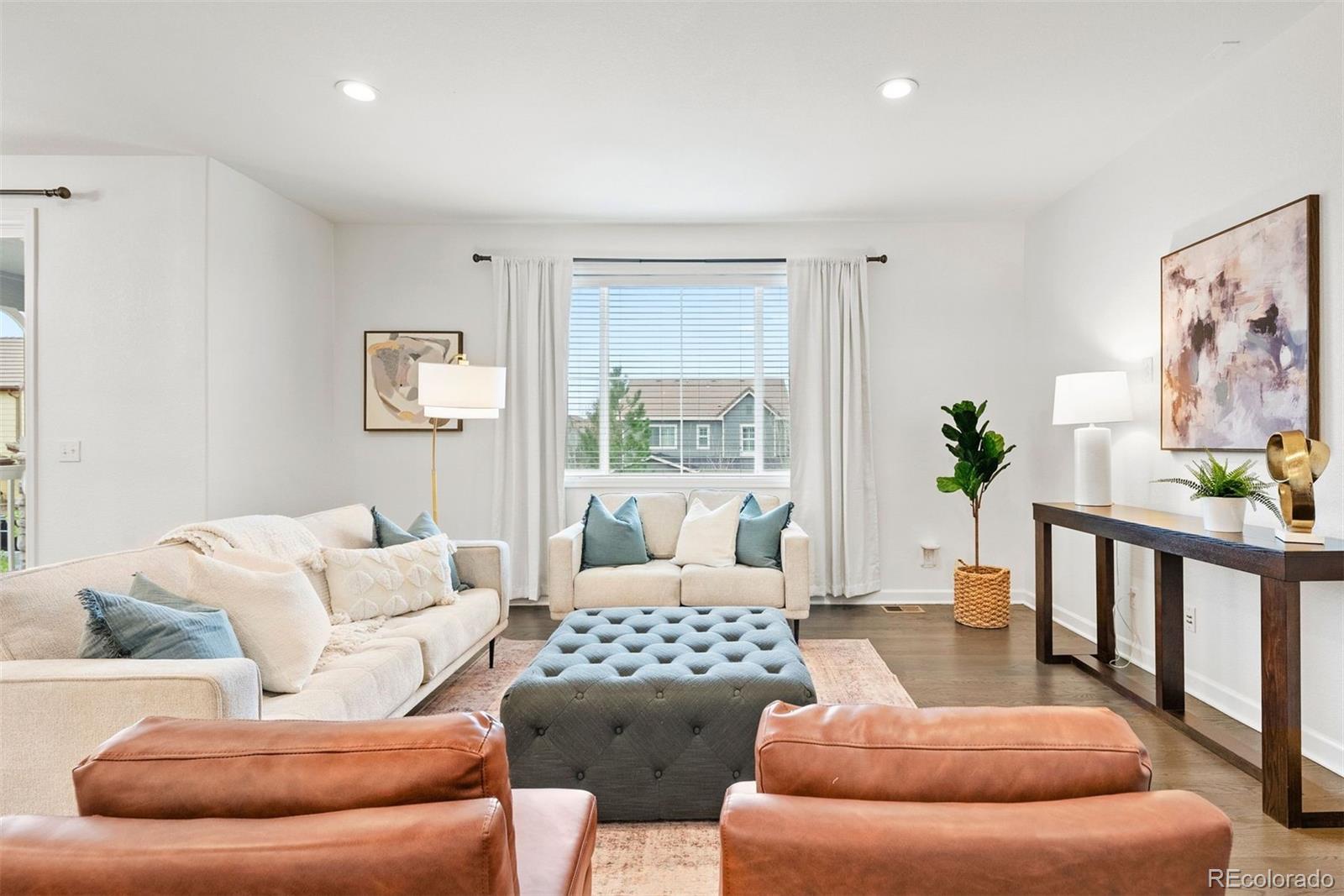 664 Tiger Lily Way Highlands Ranch, CO 80126 - Photo 15 of 47 a living room with furniture and a large window