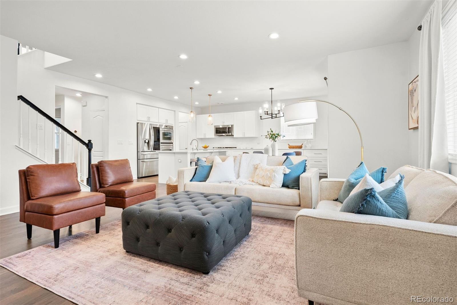 664 Tiger Lily Way Highlands Ranch, CO 80126 - Photo 17 of 47 a living room with furniture and kitchen view