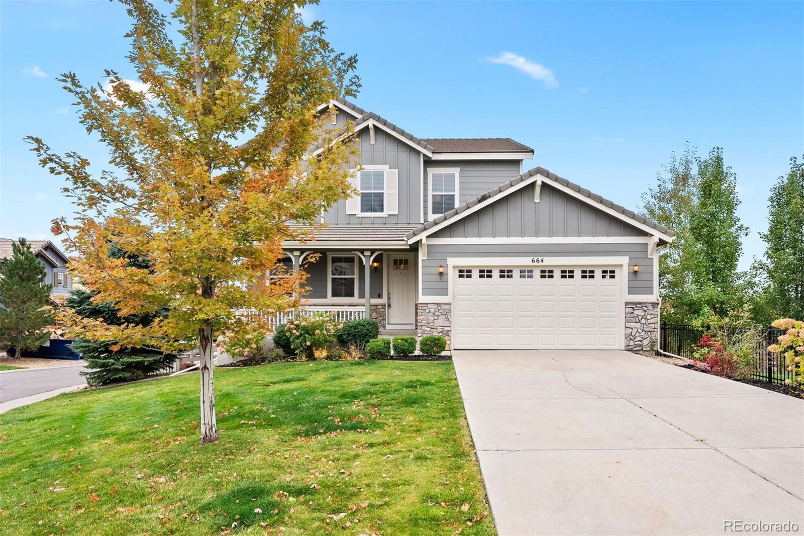 664 Tiger Lily Way Highlands Ranch, CO 80126 - Photo 2 of 47 a view of a house with a yard and pathway
