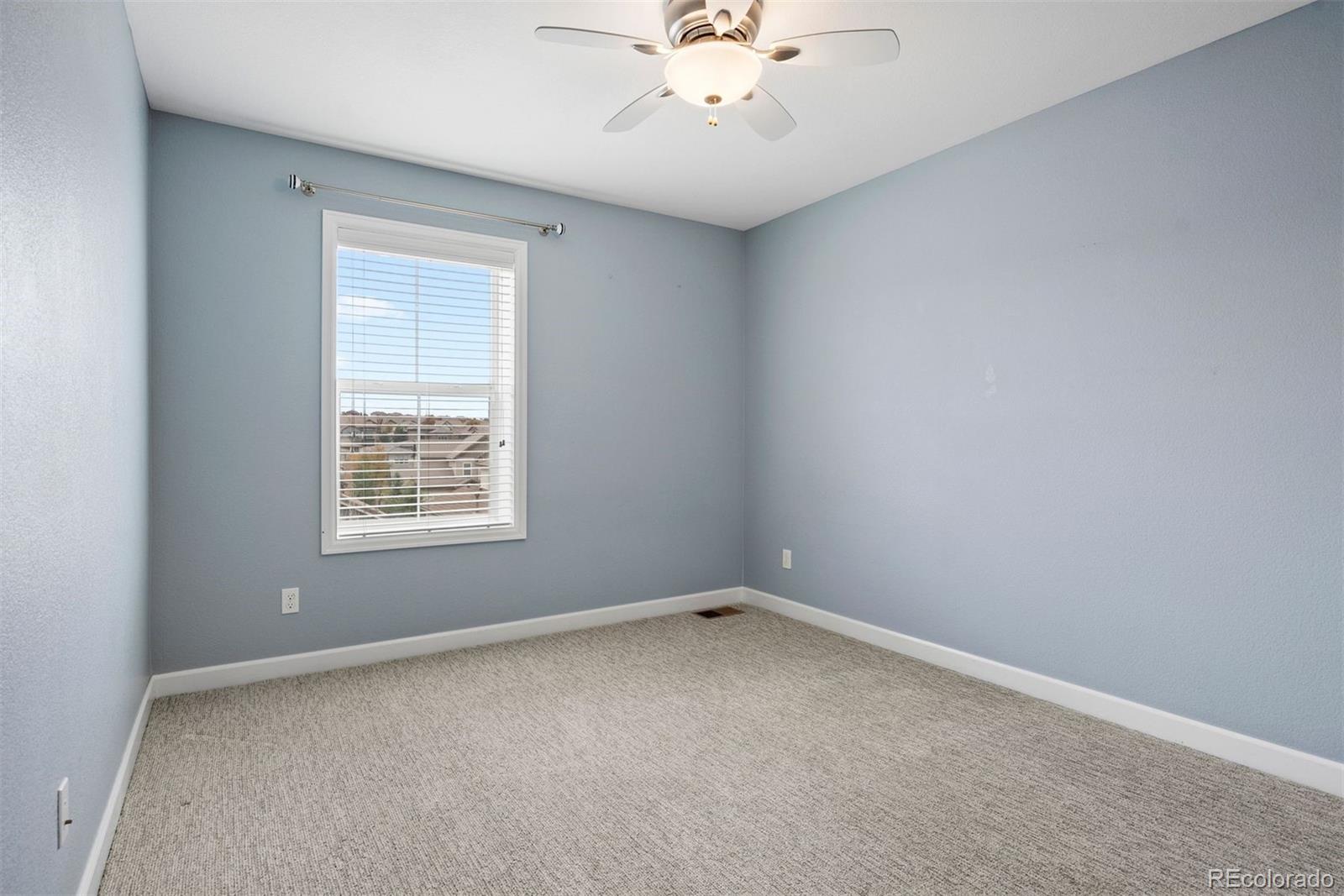 664 Tiger Lily Way Highlands Ranch, CO 80126 - Photo 27 of 47 an empty room with a window