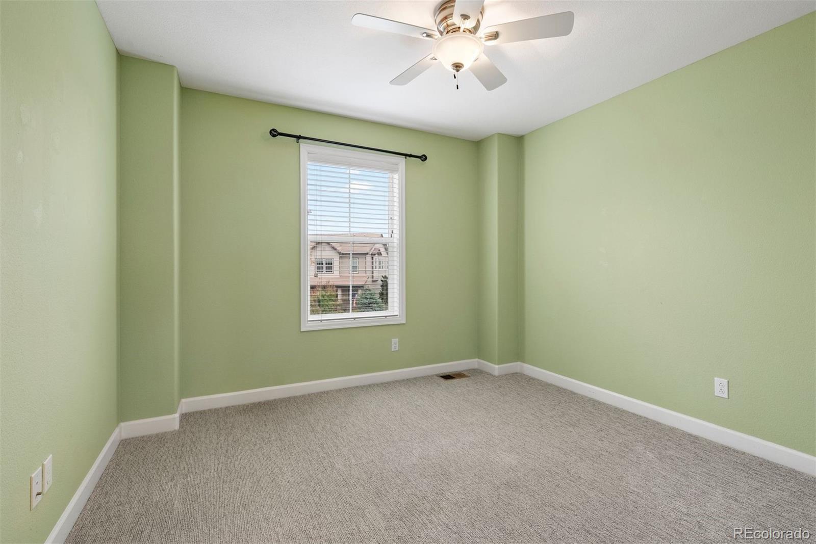664 Tiger Lily Way Highlands Ranch, CO 80126 - Photo 28 of 47 an empty room with a window