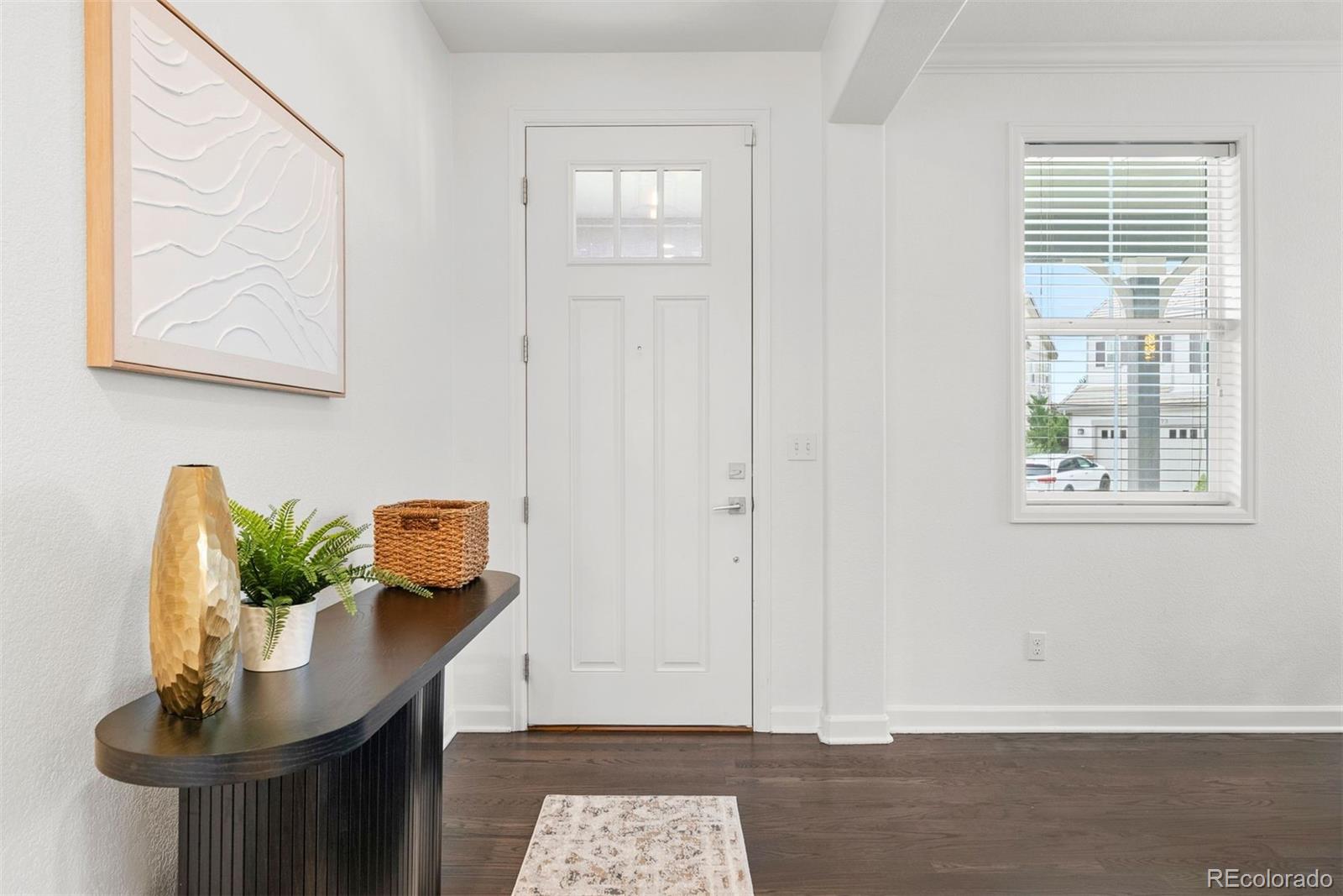 664 Tiger Lily Way Highlands Ranch, CO 80126 - Photo 3 of 47 a view of a workspace with furniture and window