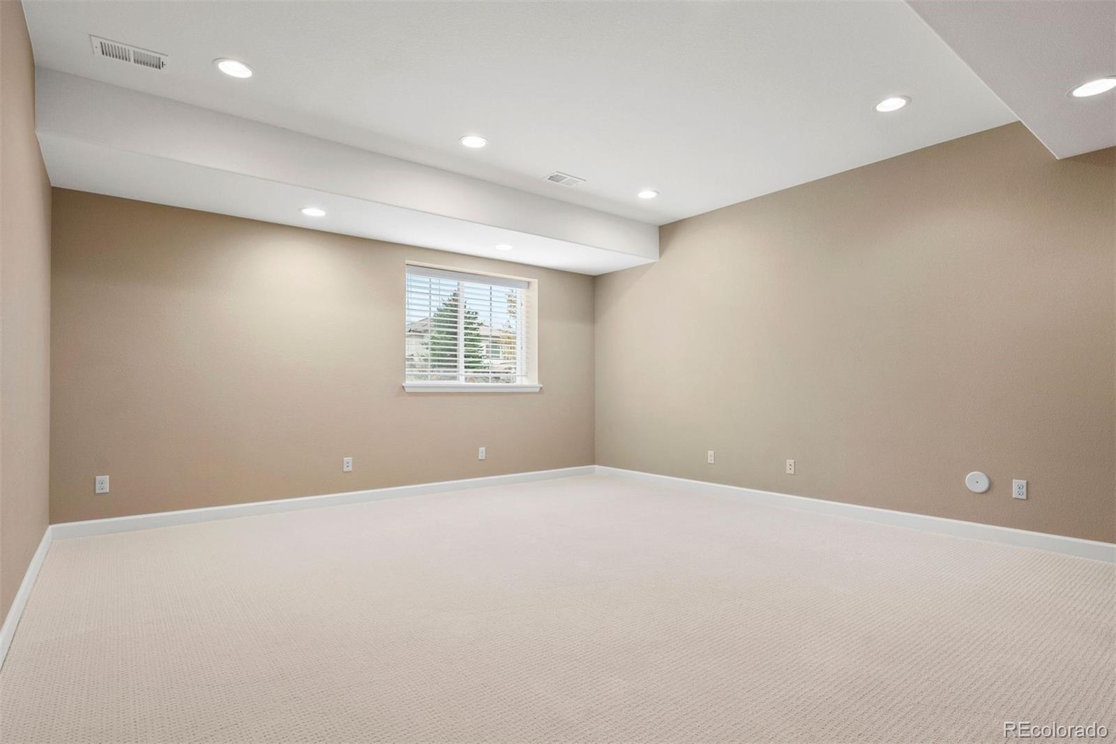 664 Tiger Lily Way Highlands Ranch, CO 80126 - Photo 31 of 47 a view of an empty room with a window