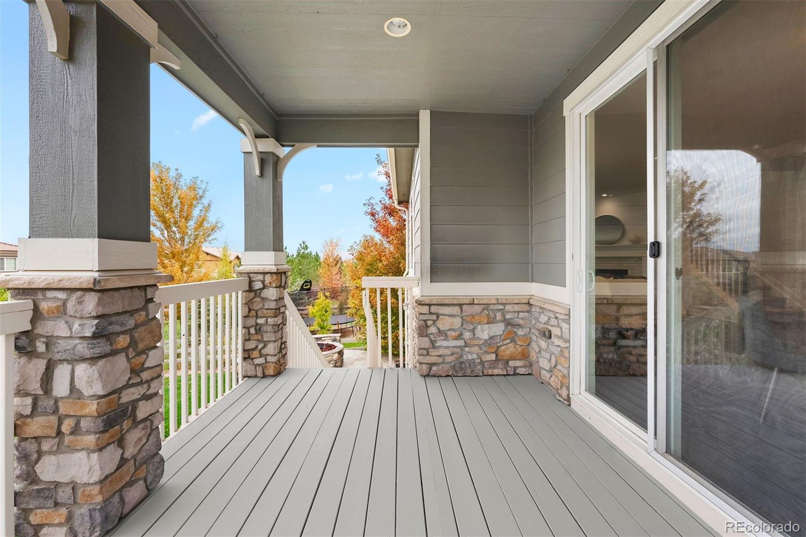 664 Tiger Lily Way Highlands Ranch, CO 80126 - Photo 40 of 47 a balcony with wooden floor