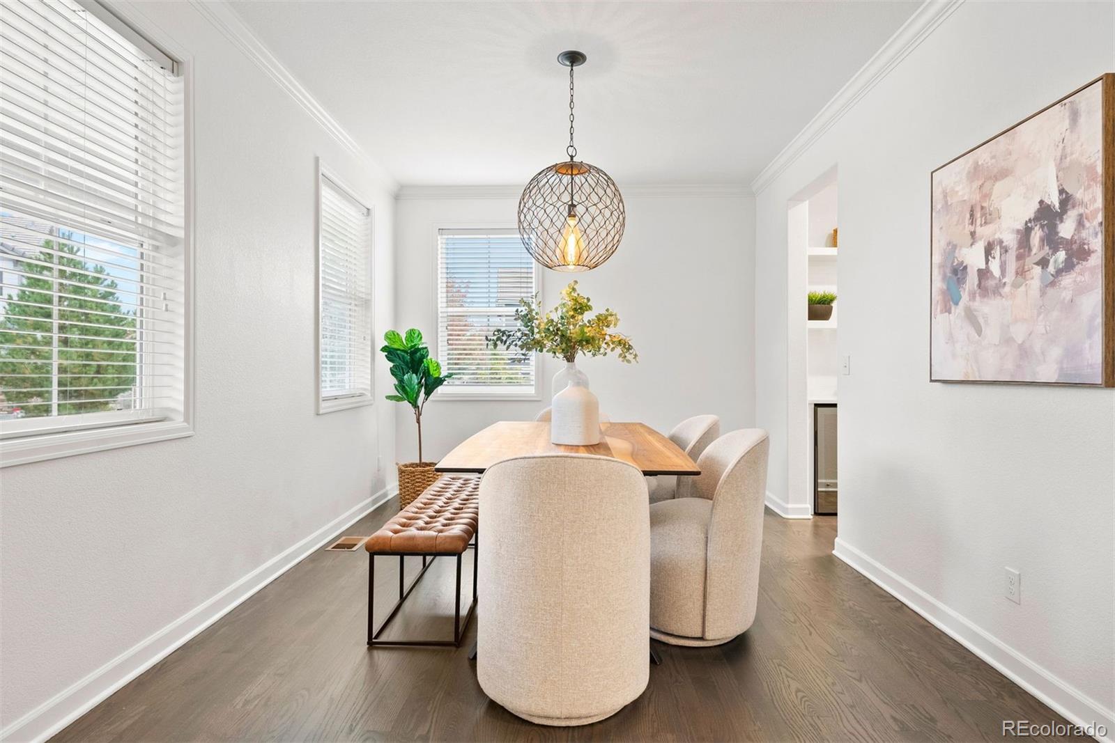 664 Tiger Lily Way Highlands Ranch, CO 80126 - Photo 4 of 47 a view of a dining room with furniture window and wooden floor