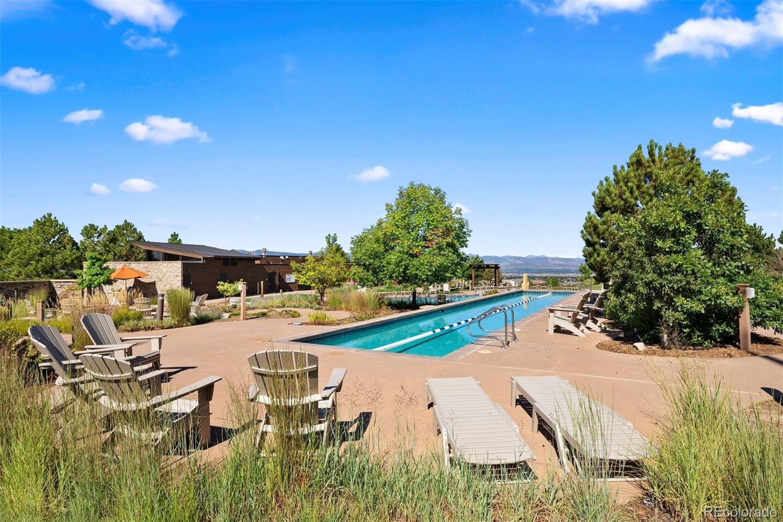 664 Tiger Lily Way Highlands Ranch, CO 80126 - Photo 42 of 47 a view of swimming pool and lake view