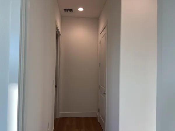a view of hallway with closet