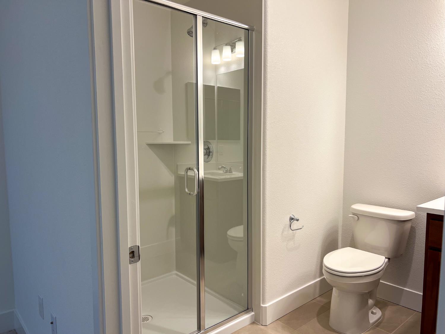 3368 Houser Court Davis, CA 95616 - Photo 16 of 19 a bathroom with a toilet and shower