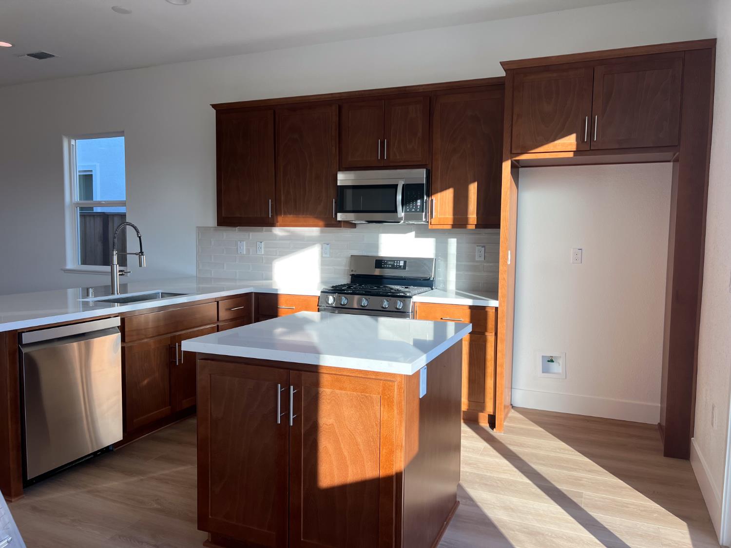 3368 Houser Court Davis, CA 95616 - Photo 3 of 19 a kitchen with stainless steel appliances granite countertop a sink stove and refrigerator
