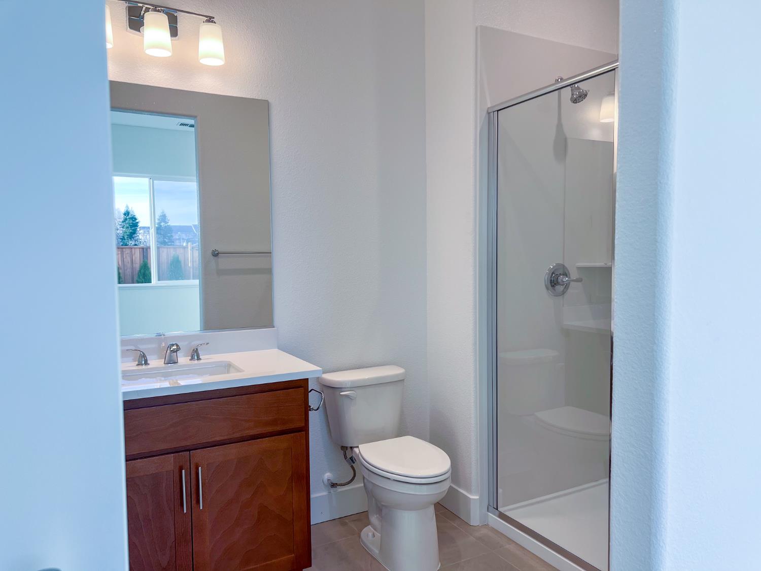 3368 Houser Court Davis, CA 95616 - Photo 9 of 19 a bathroom with a sink a toilet and shower