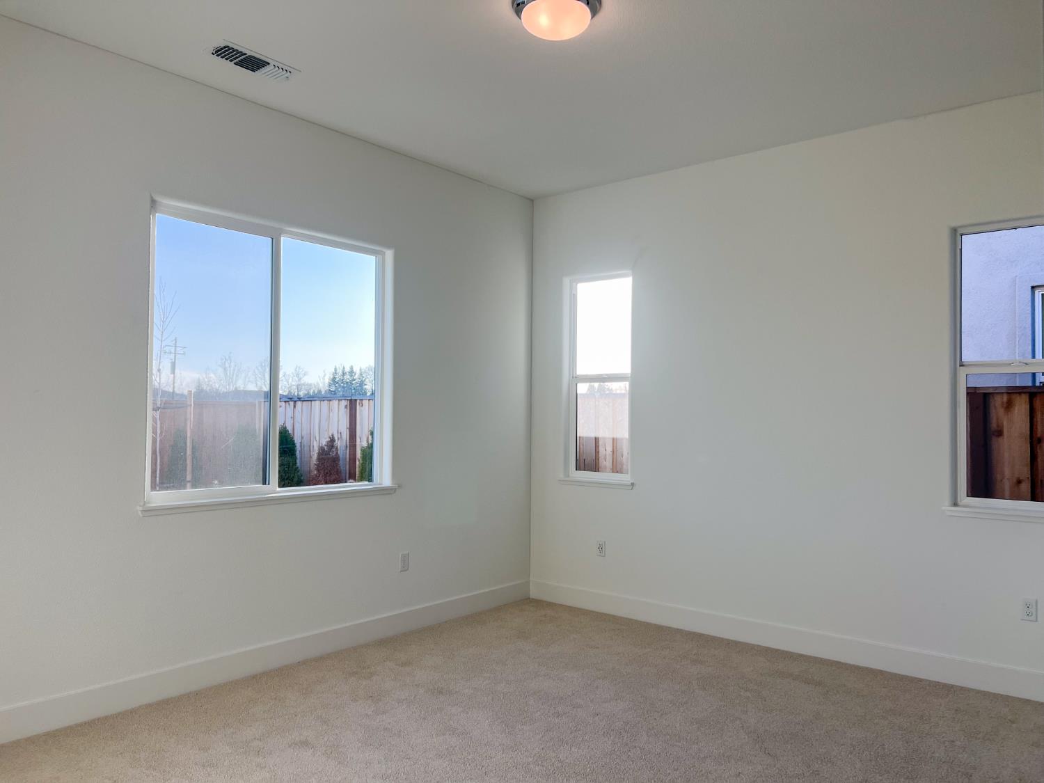 3368 Houser Court Davis, CA 95616 - Photo 10 of 19 an empty room with windows and closet