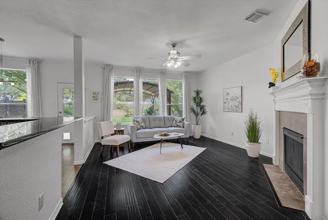a living room with furniture and a fireplace