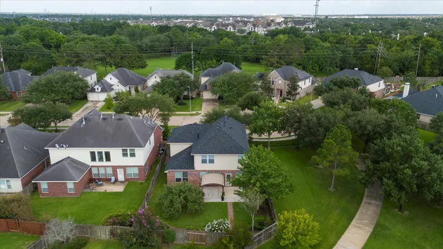 an aerial view of a house with a garden