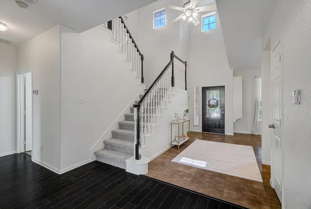 a view of entryway and hall with wooden floor
