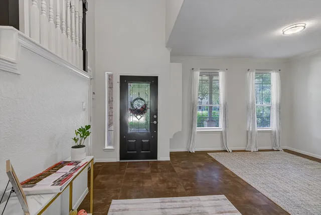a living room with furniture and window