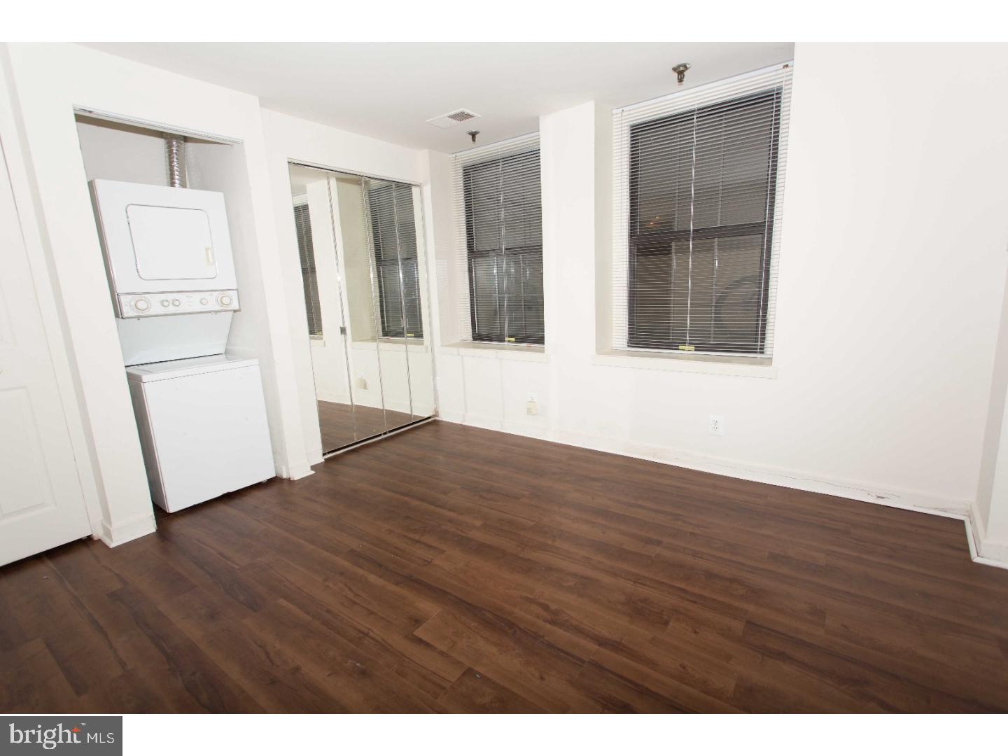 130 Arch Street, Unit 104 Philadelphia, PA 19106 - Photo 13 of 22 a view of empty room with wooden floor and window