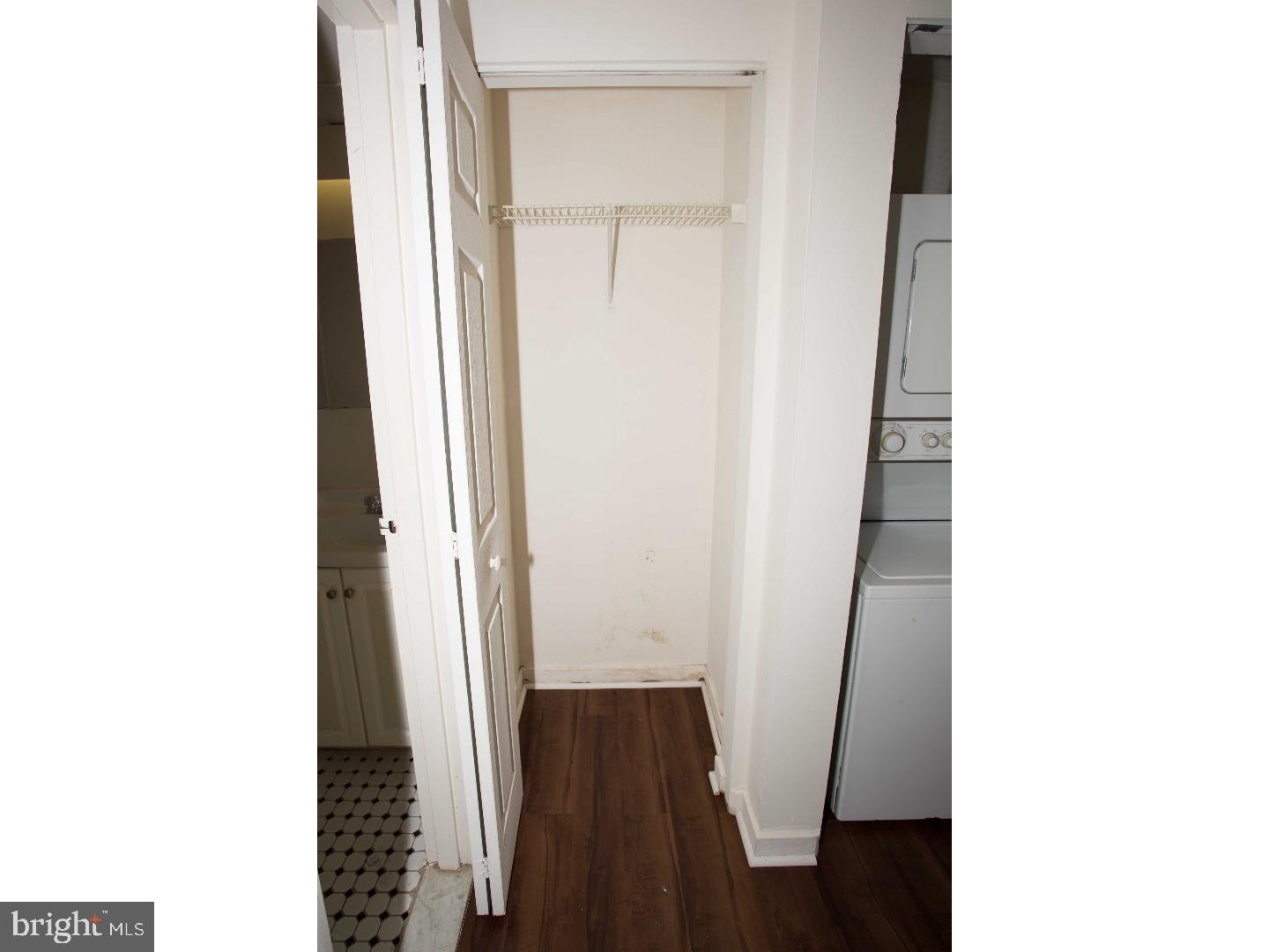 130 Arch Street, Unit 104 Philadelphia, PA 19106 - Photo 18 of 22 a view of a hallway with wooden floor