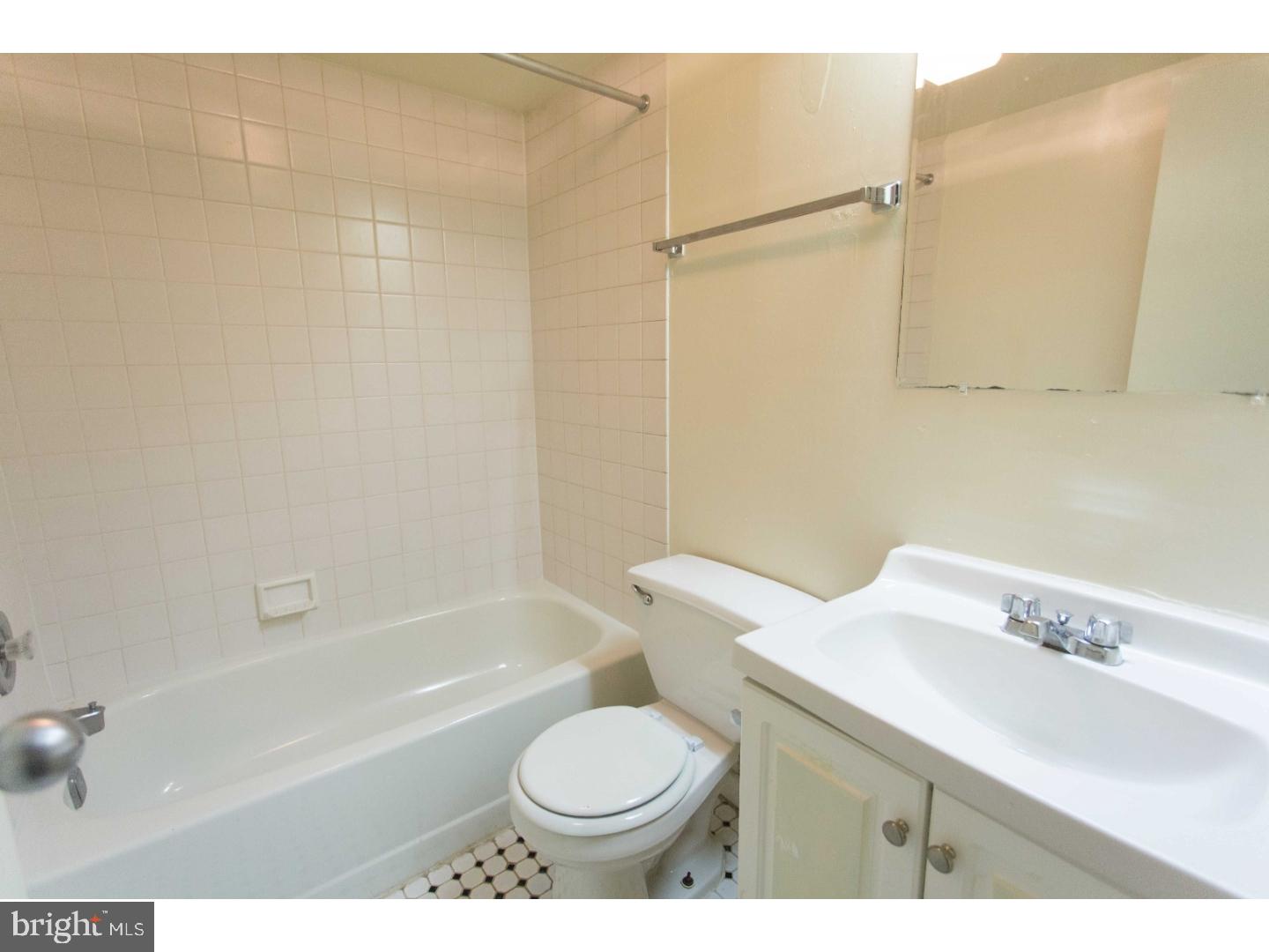130 Arch Street, Unit 104 Philadelphia, PA 19106 - Photo 20 of 22 a bathroom with a sink toilet and shower