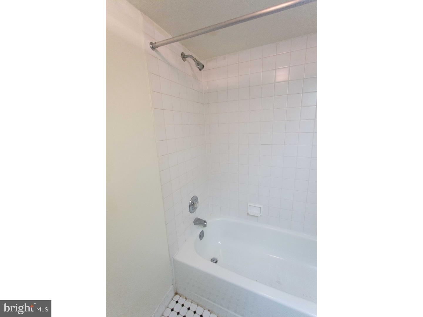 130 Arch Street, Unit 104 Philadelphia, PA 19106 - Photo 22 of 22 a bath tub sitting next to a white sink