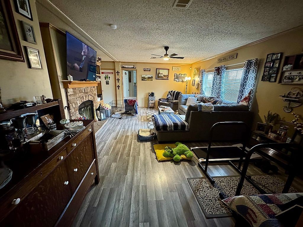 3351 East State Line Road Union City, TN 38261 - Photo 8 of 36 a living room with lots of furniture and gym equipment
