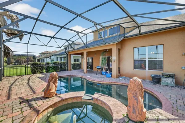 a view of a patio with table and chairs potted plants